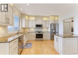 Beautifully updated kitchen with granite counters and stainless steel appliances -