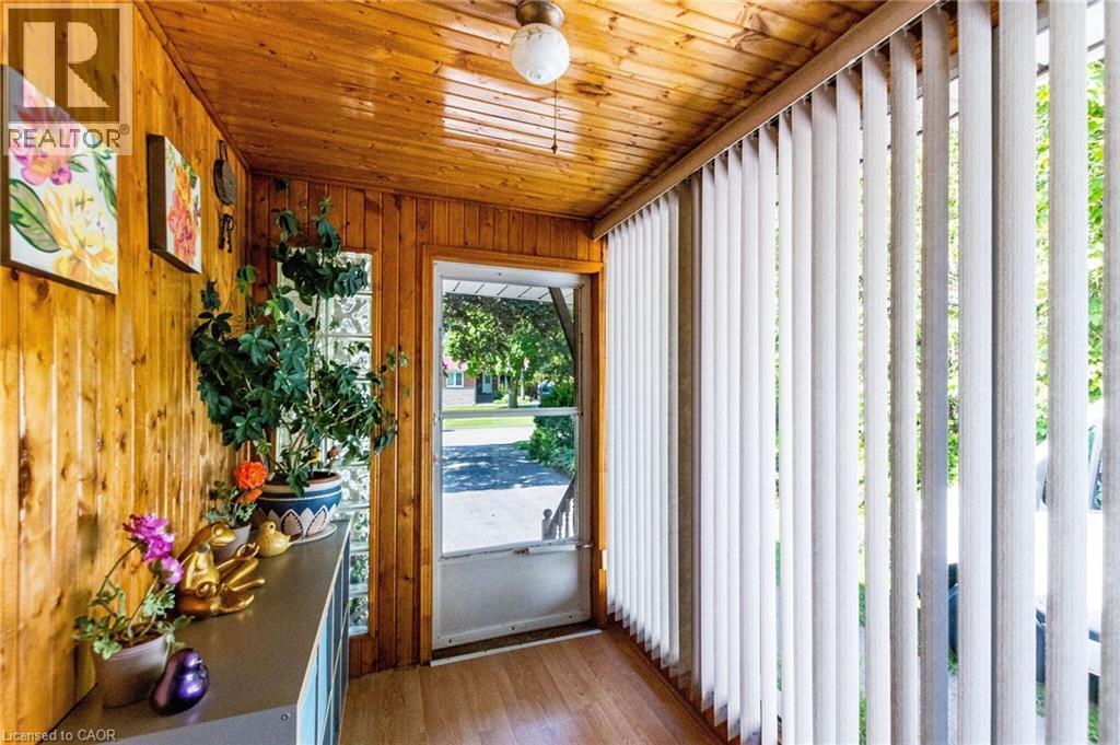 Sunroom featuring extensive wood paneling on walls and ceiling - 1293 Daimler Road, Mississauga, ON - Indoor Photo Showing Other Room