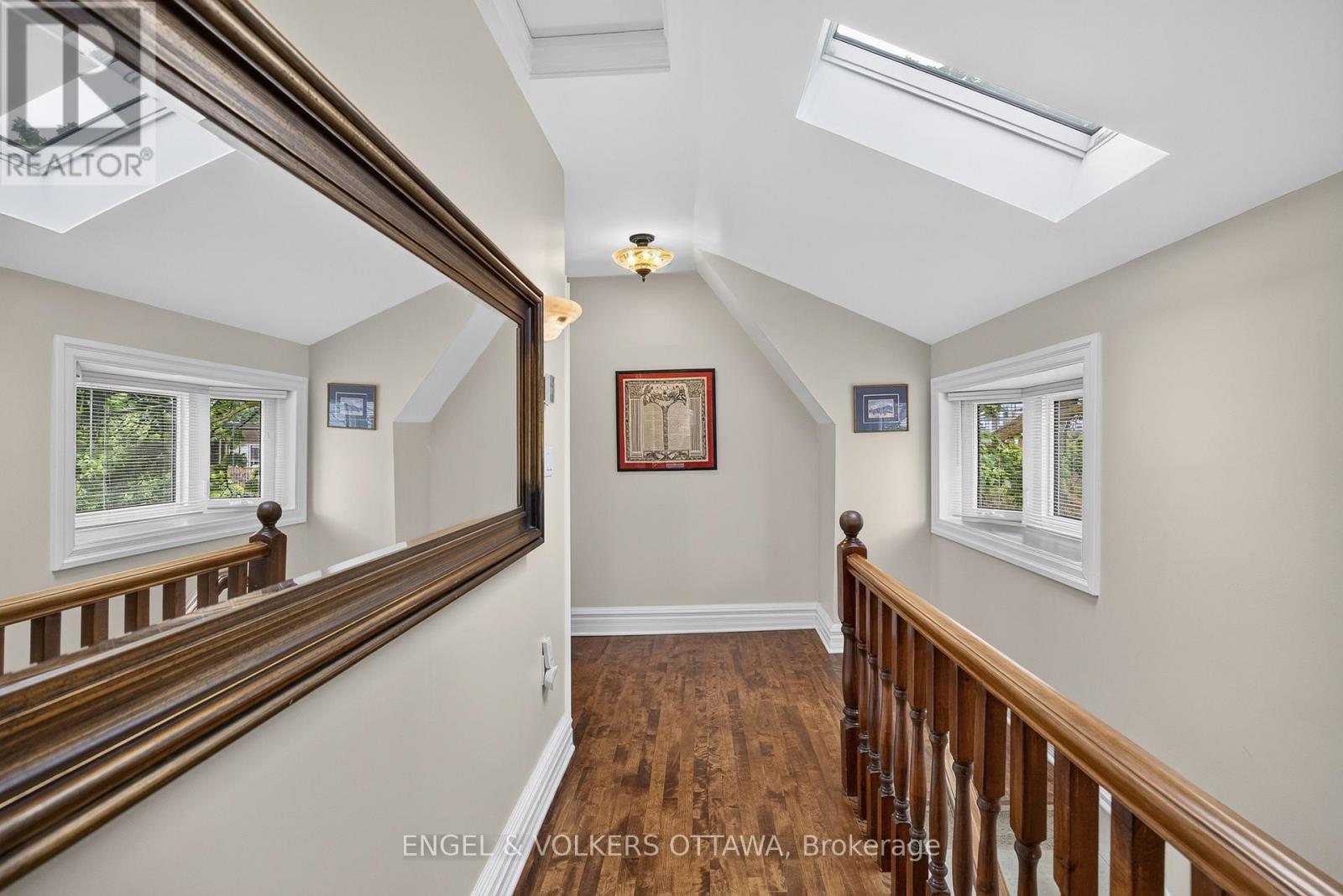 Beautiful sunny landing and wood staircase. - 119 Strathcona Avenue, Ottawa, ON