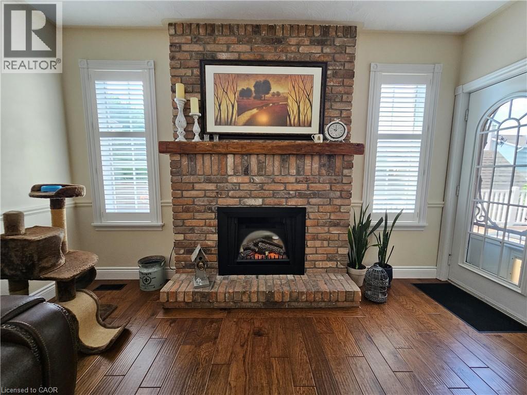 Brick fireplace and walk-out to rear deck - 120 Lynndale Road, Simcoe, ON