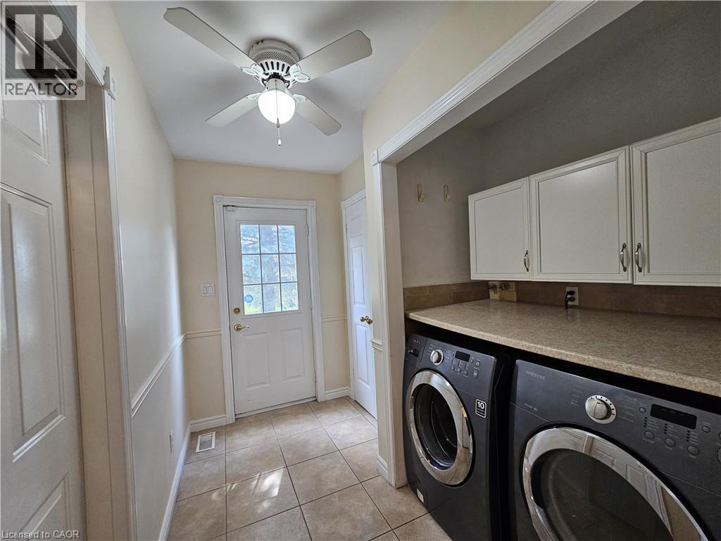 Laundry area with countertop and upper cabinetry - 120 Lynndale Road, Simcoe, ON