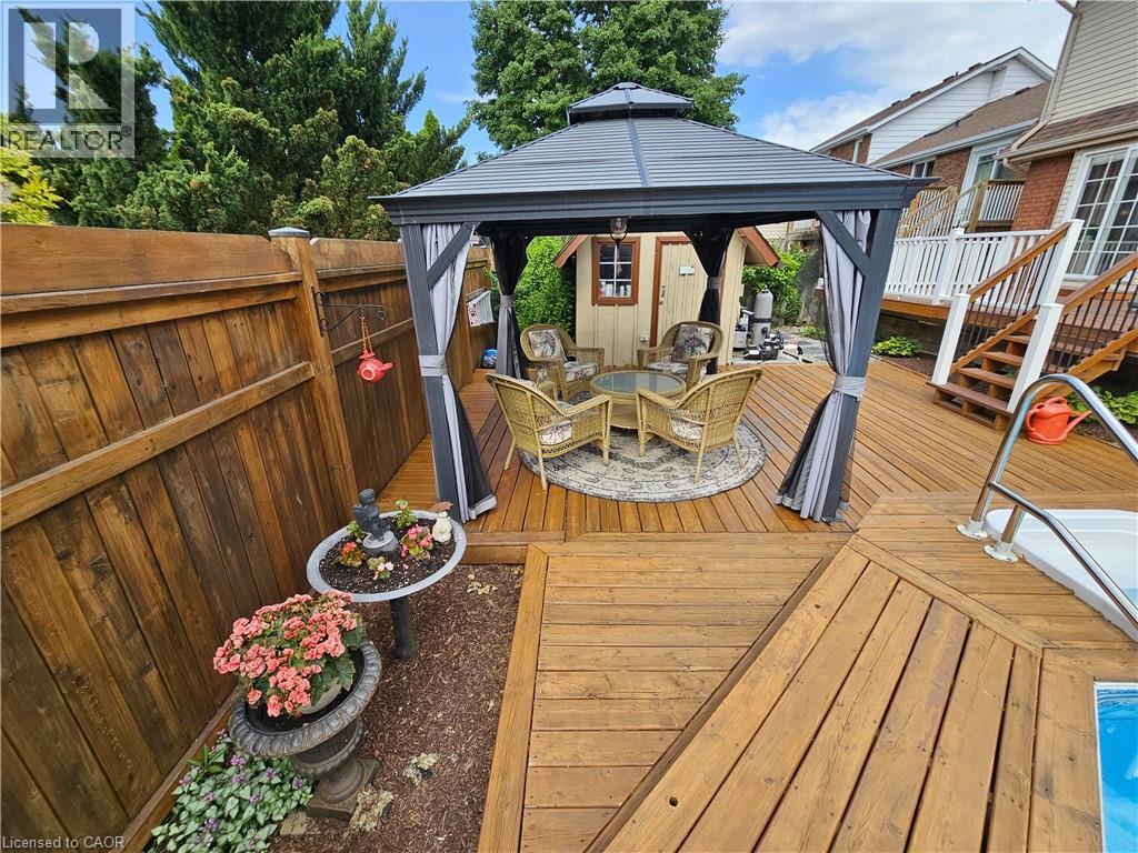 Multi-tier deck with manicured gardens and gazebo - 120 Lynndale Road, Simcoe, ON