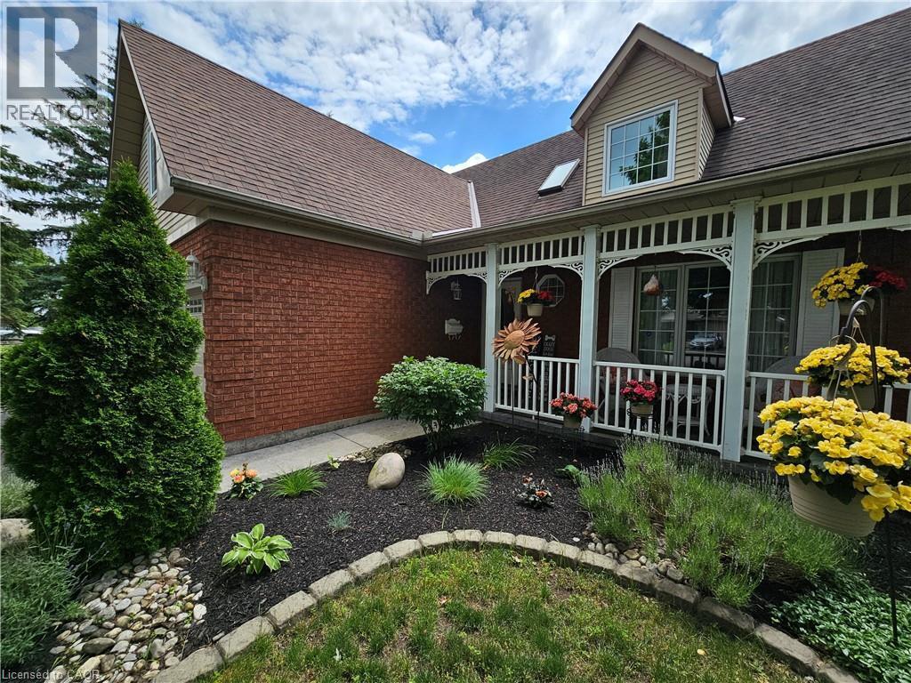 Decorative stone borders and diverse plantings - 120 Lynndale Road, Simcoe, ON