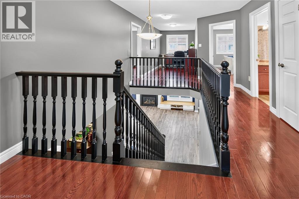Hardwood stairs leading into main level. - 43 Wilbur Drive, Binbrook, ON