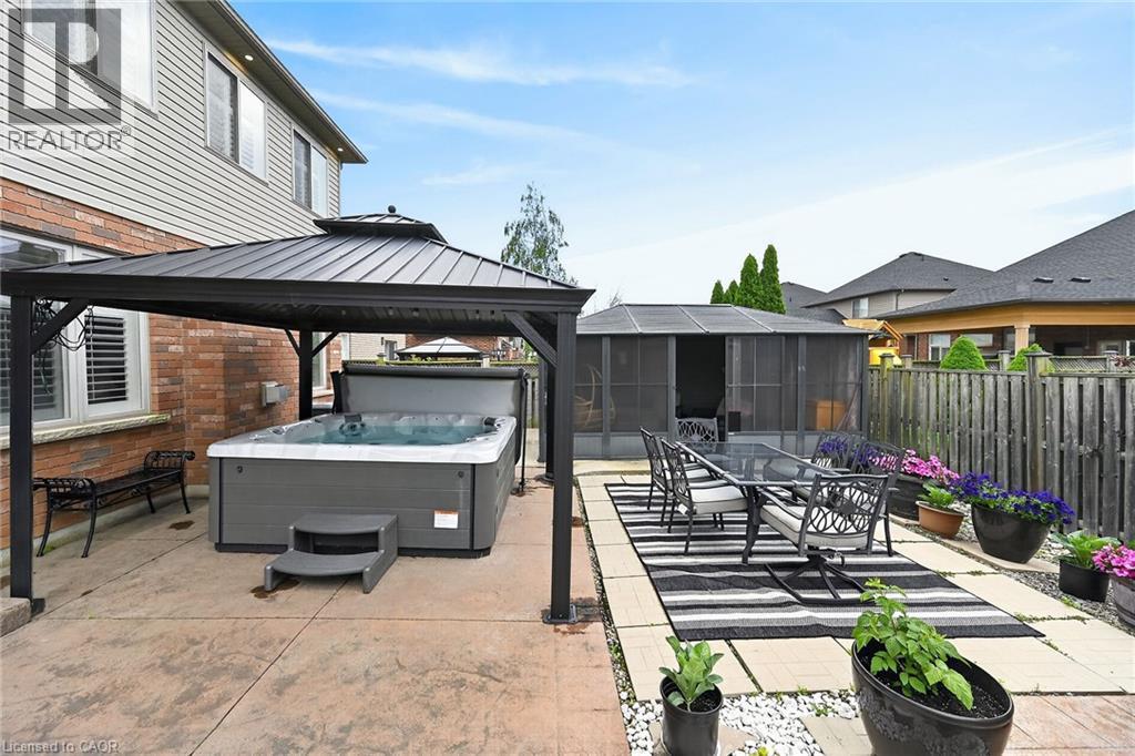Large hot tub covered with sun safe Gazebo - 43 Wilbur Drive, Binbrook, ON