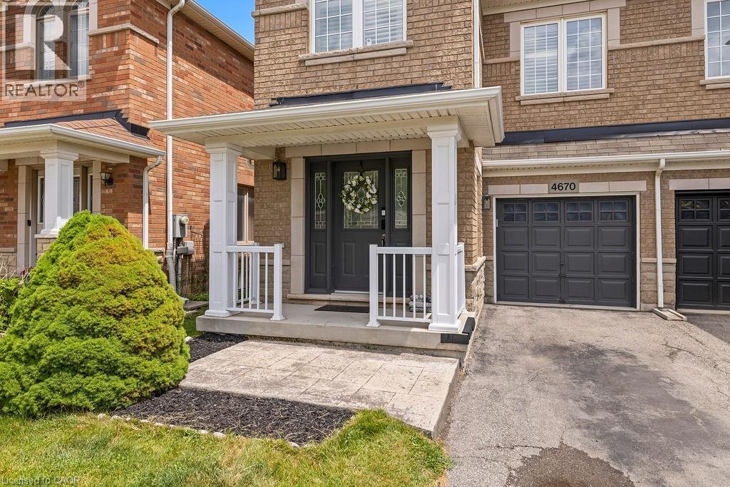Brick facade with stone accents and white trim - 4670 Thomas Alton Boulevard, Burlington, ON