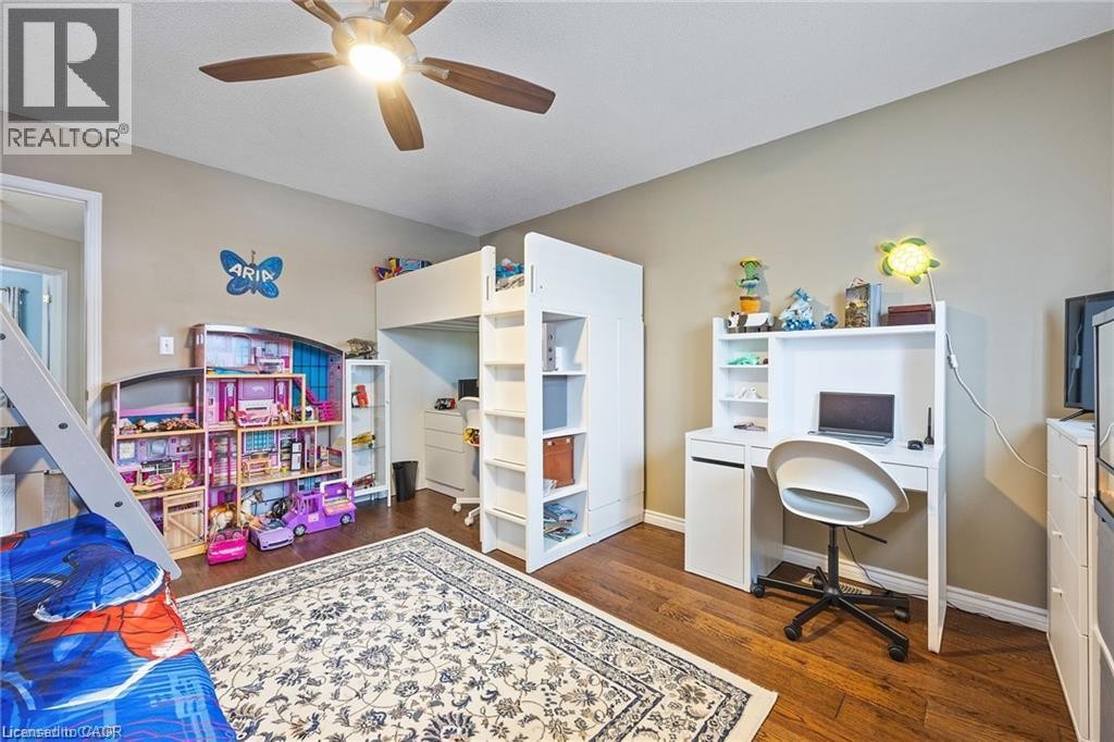 Hardwood-style flooring, neutral wall paint, and a built-in ceiling fan with integrated lighting - 125 Terni Boulevard, Hamilton, ON - Indoor Photo Showing Office