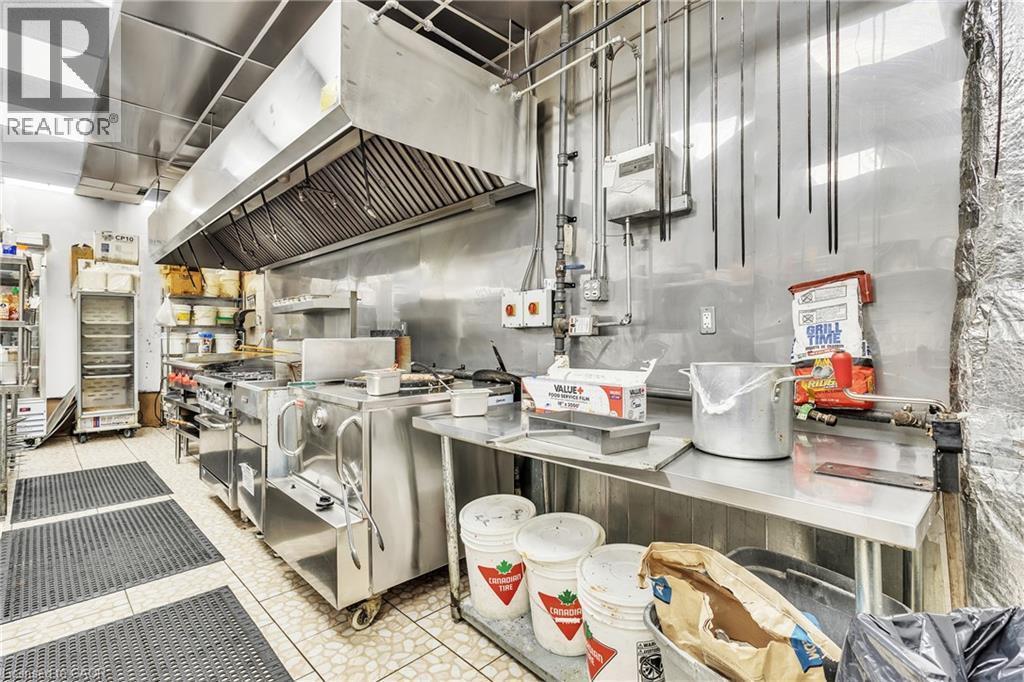 Commercial kitchen featuring stainless steel appliances and surfaces - 155 Highland Road E, Kitchener, ON