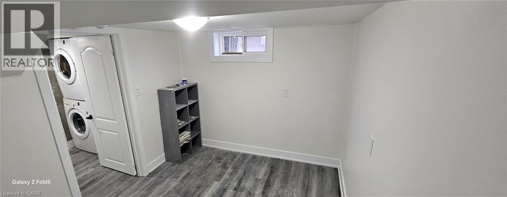 Finished room featuring wood-finish flooring and a window - 134 E Bridgeport Road E Unit# Lower, Waterloo, ON