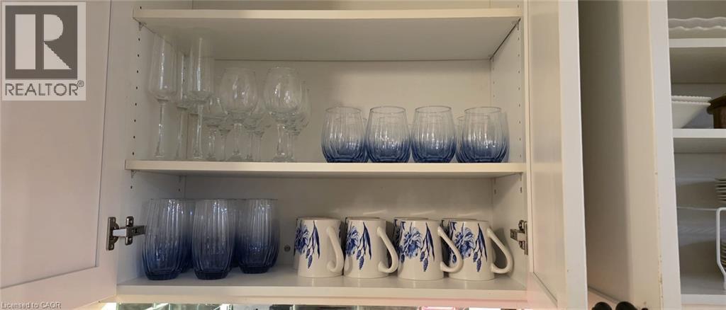 White kitchen cabinetry featuring interior shelving - 134 Bridgeport Road E Unit# Upper, Waterloo, ON