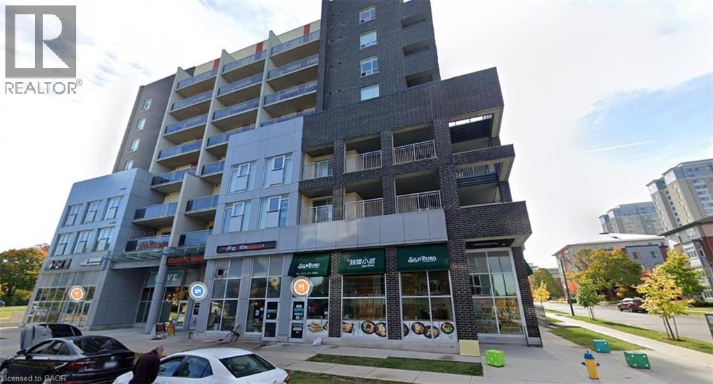 Modern multi-story building featuring a facade of dark brick and light grey panels - 280 Lester Street Unit# 607, Waterloo, ON