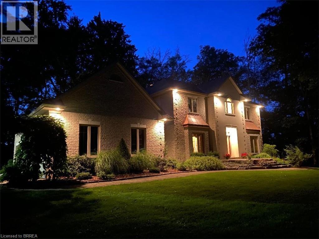 Exterior elevation featuring brick and stone masonry, multiple gables, and a prominent entry - 271 Windham Rd 14, Simcoe, ON