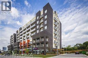 Contemporary multi-story building featuring dark brick and light-colored siding - 280 Lester Street Unit# 607, Waterloo, ON