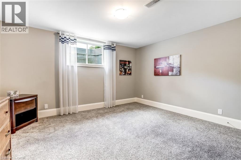 Lower level bedroom with egress window. - 59 Decou Road, Simcoe, ON