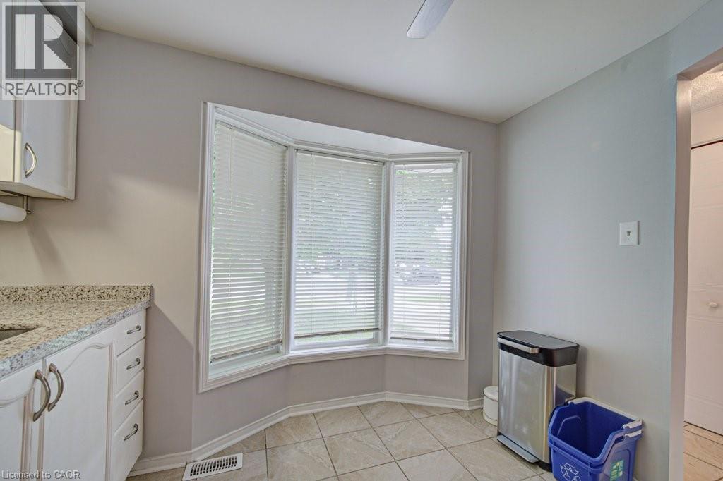 Bay window with horizontal blinds - 854 Elgin Street N, Cambridge, ON