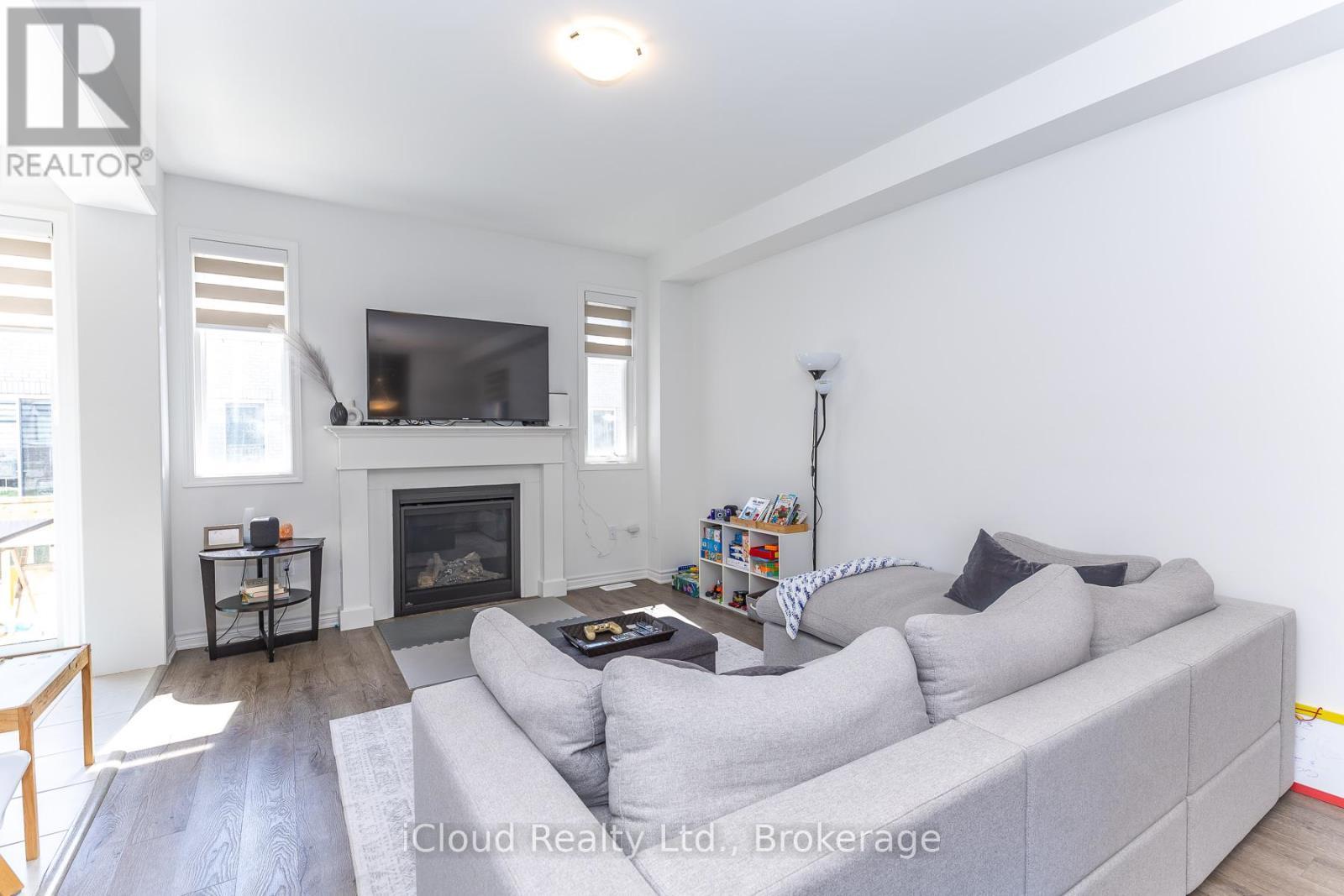 302 Calla Point, Milton, ON - Indoor Photo Showing Living Room With Fireplace