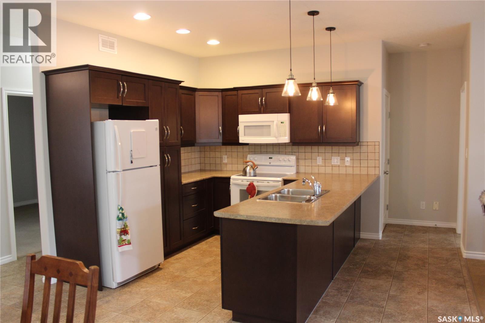 108 Erickson Street, Midale, SK - Indoor Photo Showing Kitchen With Double Sink