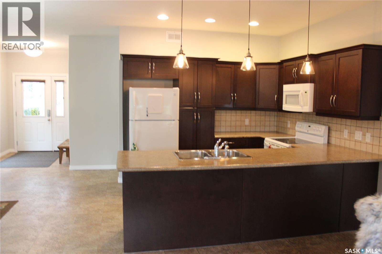108 Erickson Street, Midale, SK - Indoor Photo Showing Kitchen With Double Sink