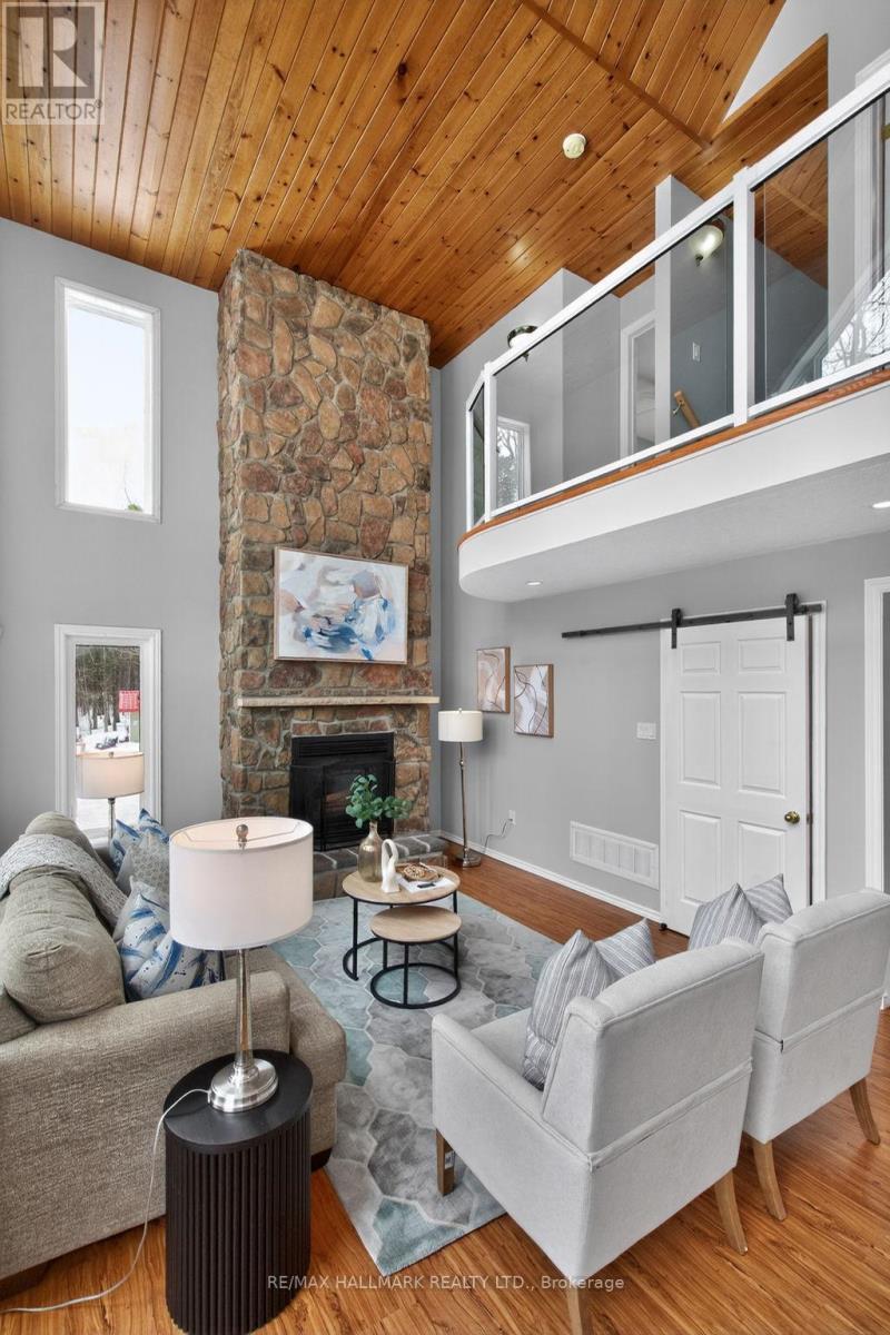 Family Room - 10 Musquake Court, Tiny, ON - Indoor Photo Showing Living Room With Fireplace