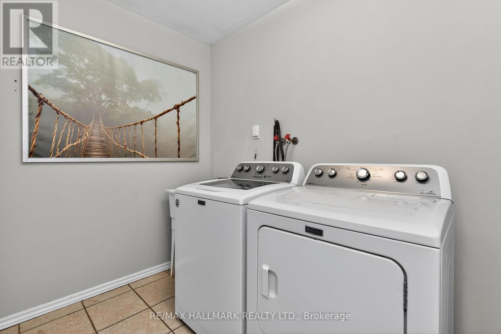 Main Floor Laundry Room - 10 Musquake Court, Tiny, ON - Indoor Photo Showing Laundry Room