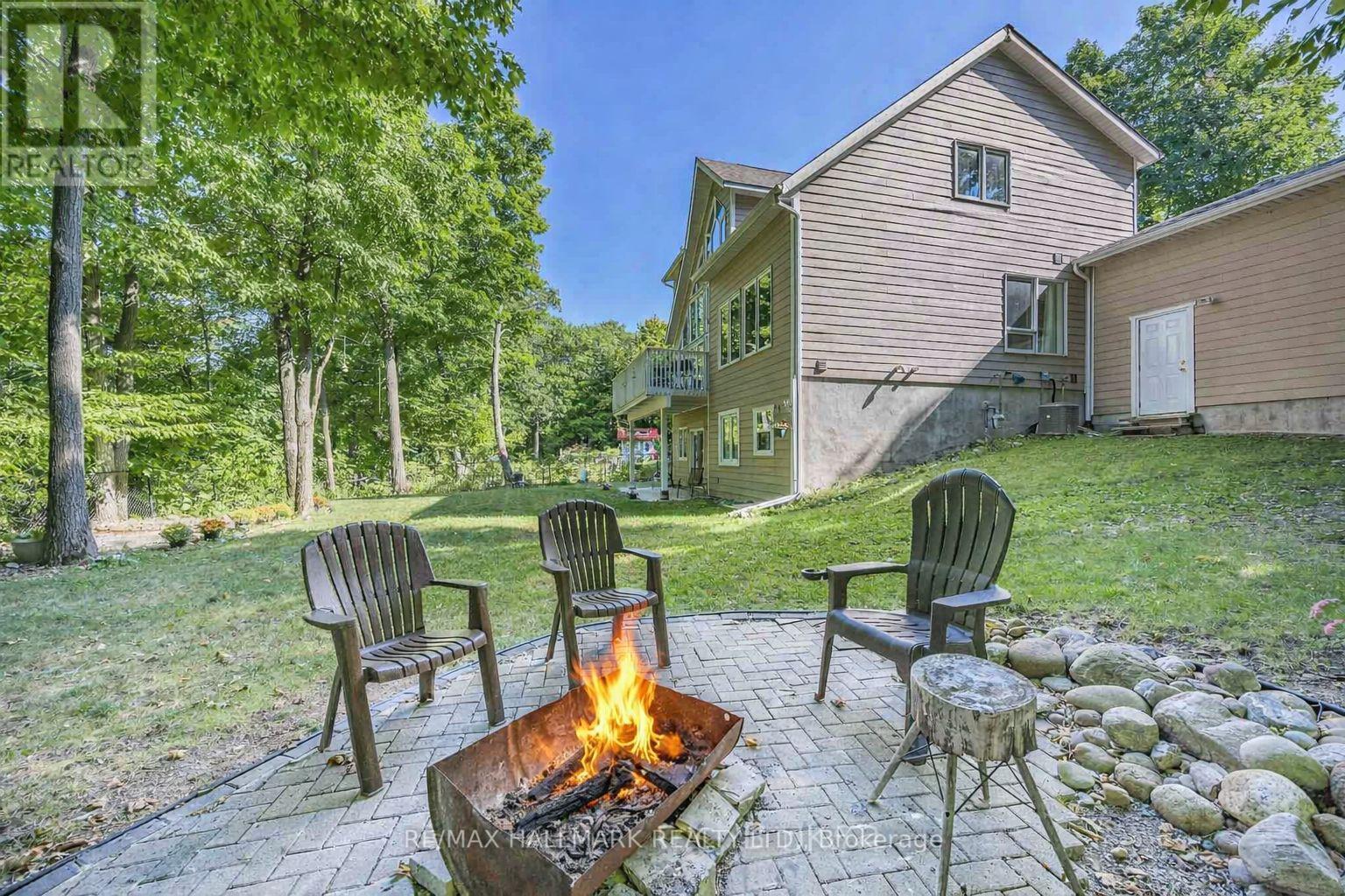 Summer Backyard - 10 Musquake Court, Tiny, ON - Outdoor With Deck Patio Veranda