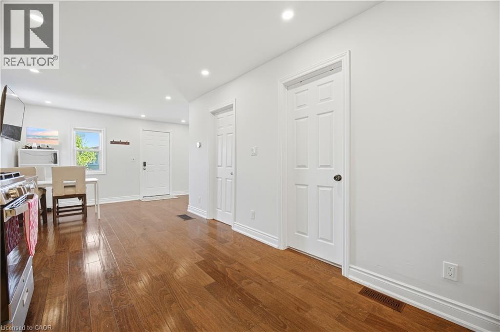 Hardwood-finish flooring extending through the space - 71 Beland Avenue N, Hamilton, ON - Indoor Photo Showing Other Room