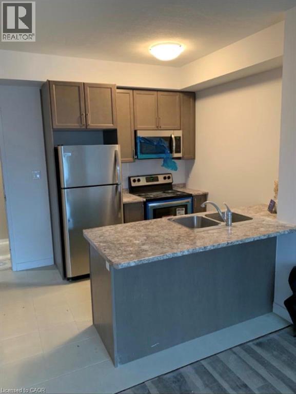 125 Shoreview Place Unit# 314, Hamilton, ON - Indoor Photo Showing Kitchen With Double Sink