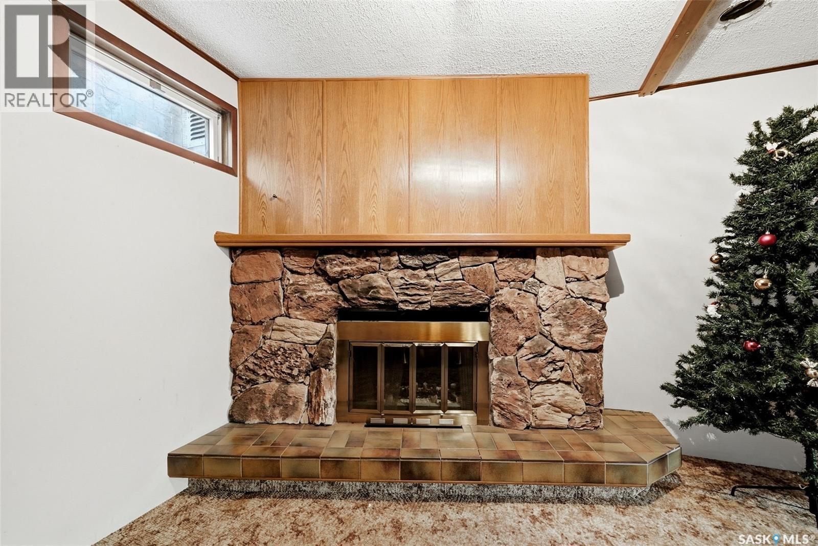 158 Trifunov Crescent, Regina, SK - Indoor With Fireplace