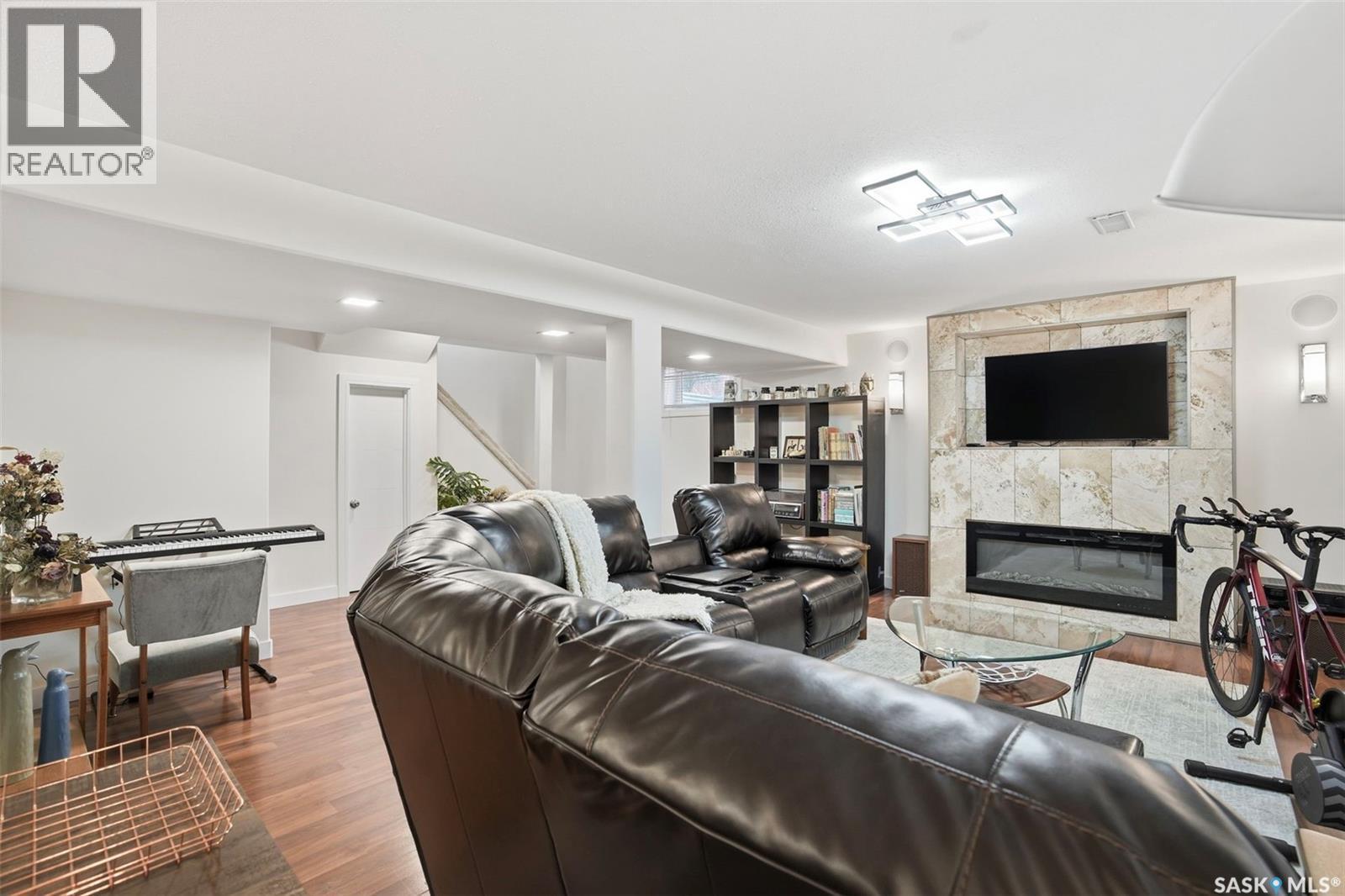 411 Auld Crescent, Saskatoon, SK - Indoor Photo Showing Living Room With Fireplace
