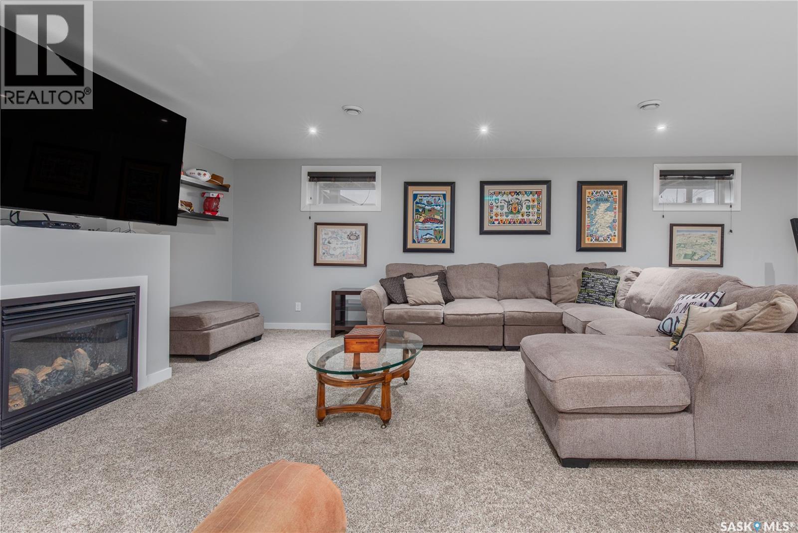 212 Iron Bridge Drive, Moose Jaw, SK - Indoor Photo Showing Living Room With Fireplace