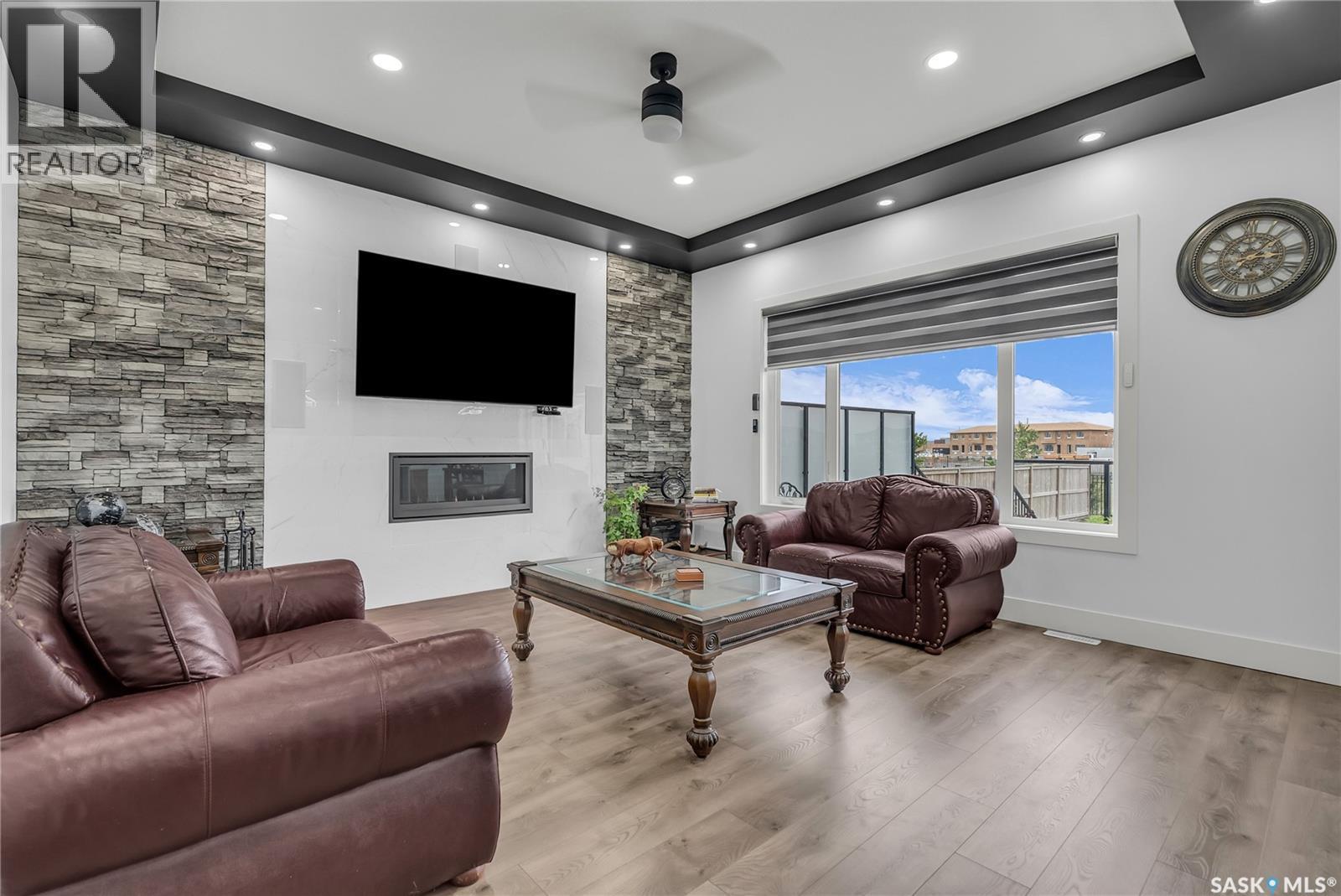 144 Forsey Avenue, Saskatoon, SK - Indoor Photo Showing Living Room With Fireplace