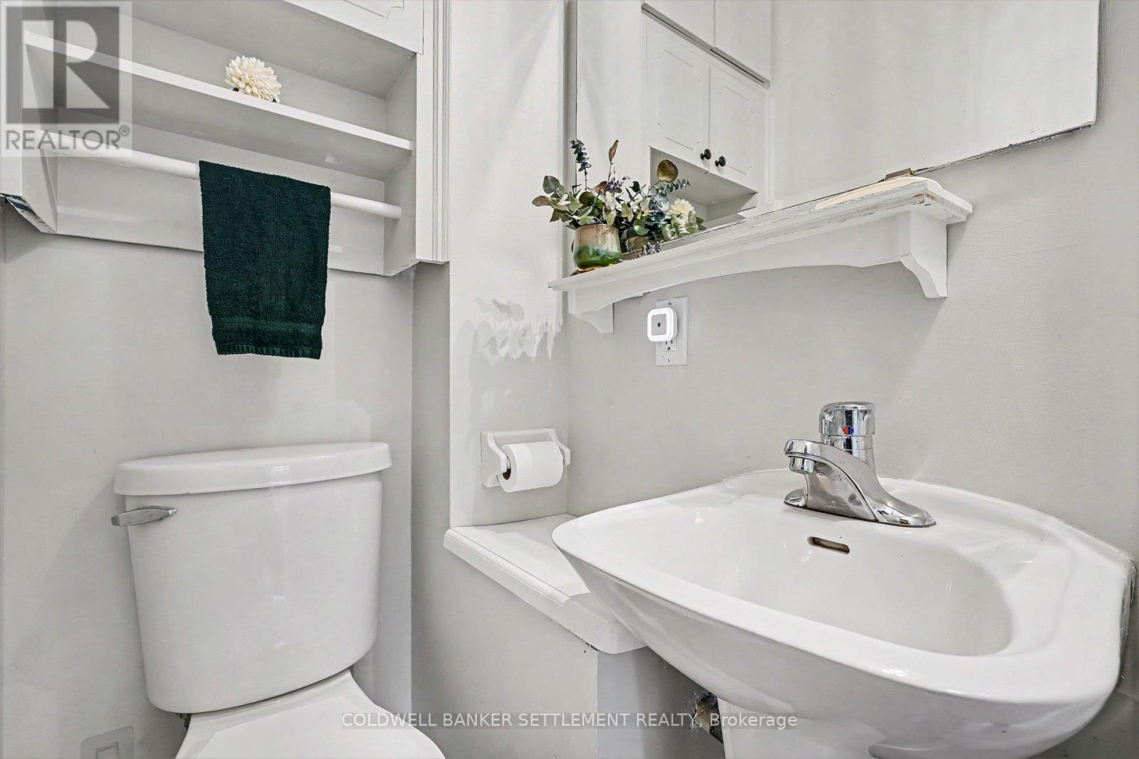 Convenient main floor 2 piece bathroom. - 1 Burchell Boulevard, Perth, ON - Indoor Photo Showing Bathroom