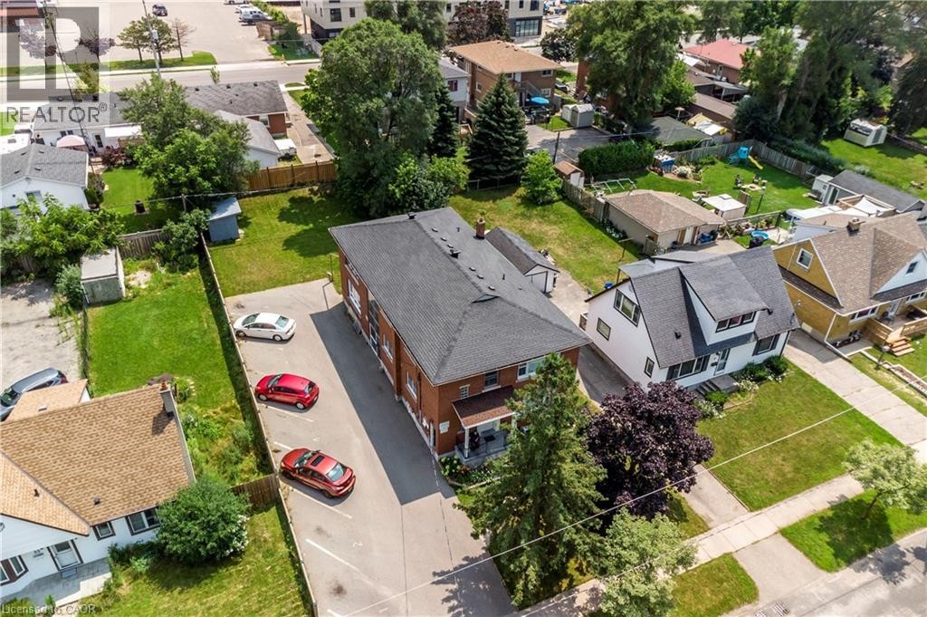 Multi-unit residential property featuring a brick exterior and a dark shingle roof - 43 Sixth Avenue, Kitchener, ON - Outdoor