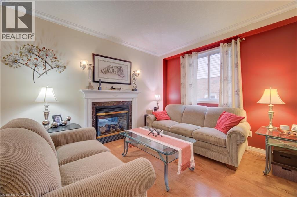 699 Commonwealth Crescent, Kitchener, ON - Indoor Photo Showing Living Room With Fireplace