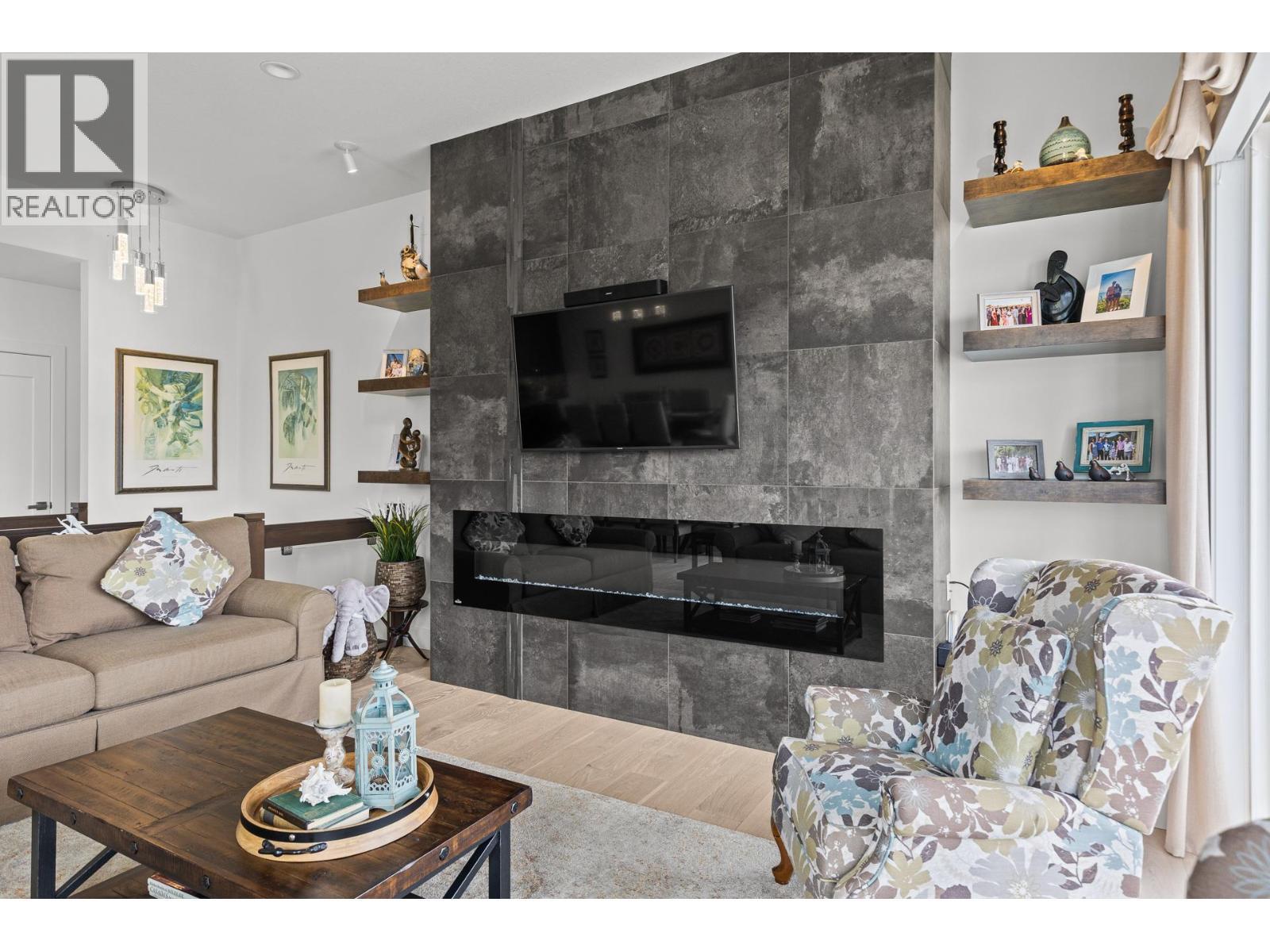 3643 Wild Rose Road, Kelowna, BC - Indoor Photo Showing Living Room With Fireplace