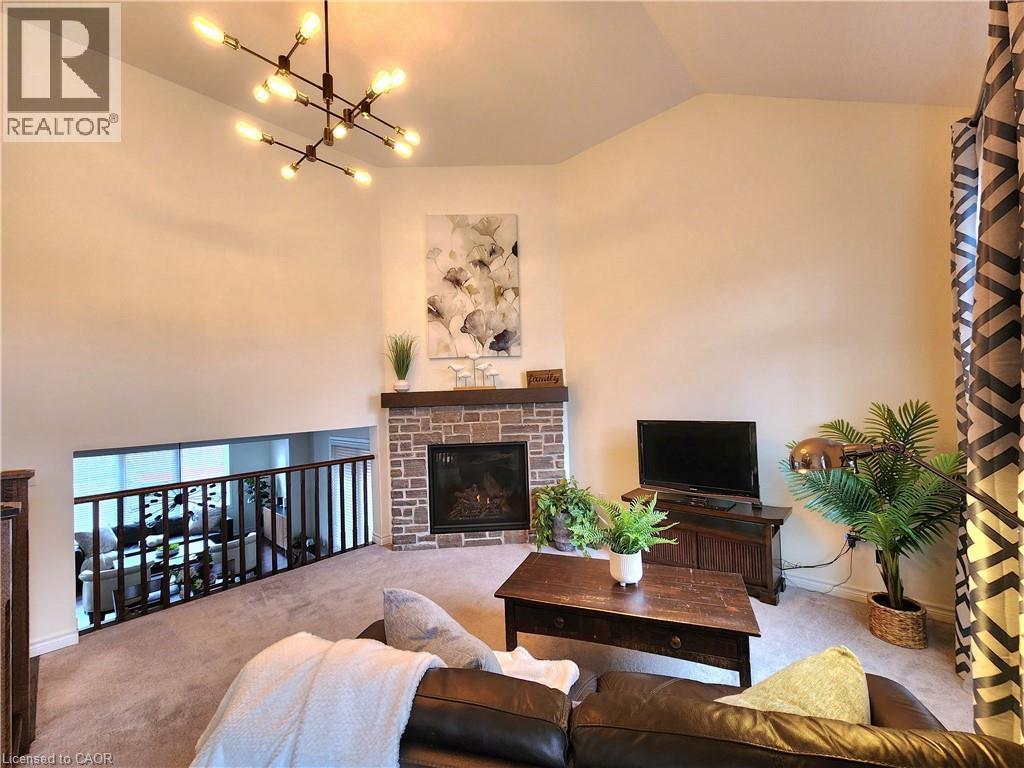 First view of the fmaily room - 259 Grovehill Crescent, Kitchener, ON - Indoor Photo Showing Living Room With Fireplace