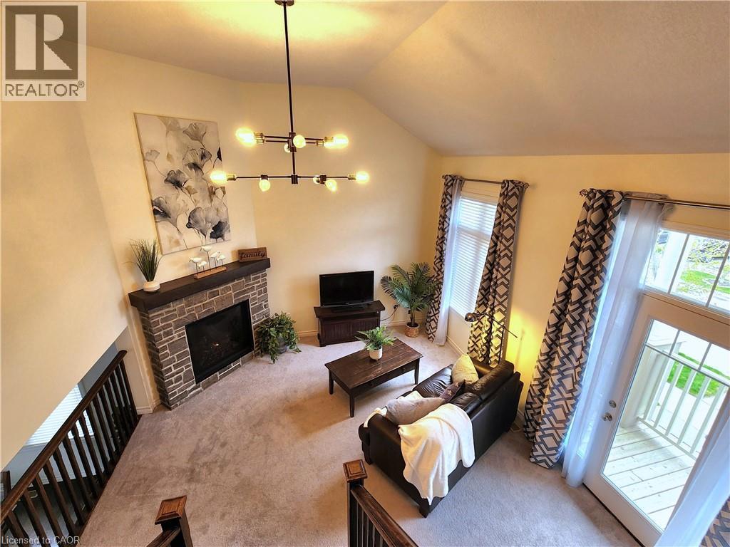 Third view of the family room - 259 Grovehill Crescent, Kitchener, ON - Indoor Photo Showing Living Room With Fireplace