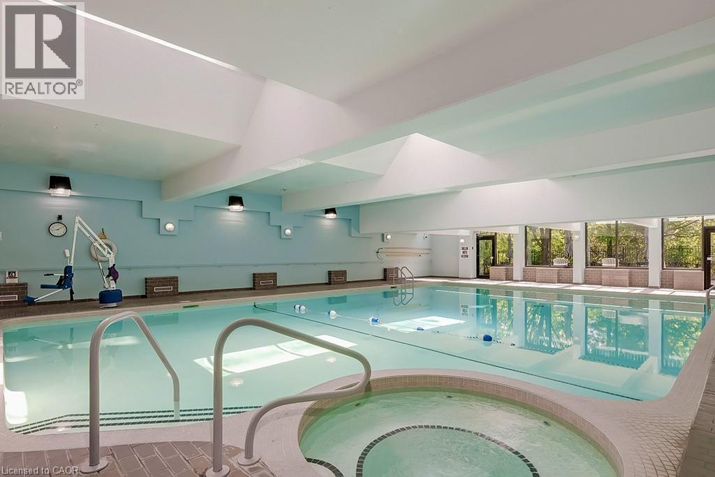 1901 Pilgrims Way Unit# 706, Oakville, ON - Indoor Photo Showing Other Room With In Ground Pool