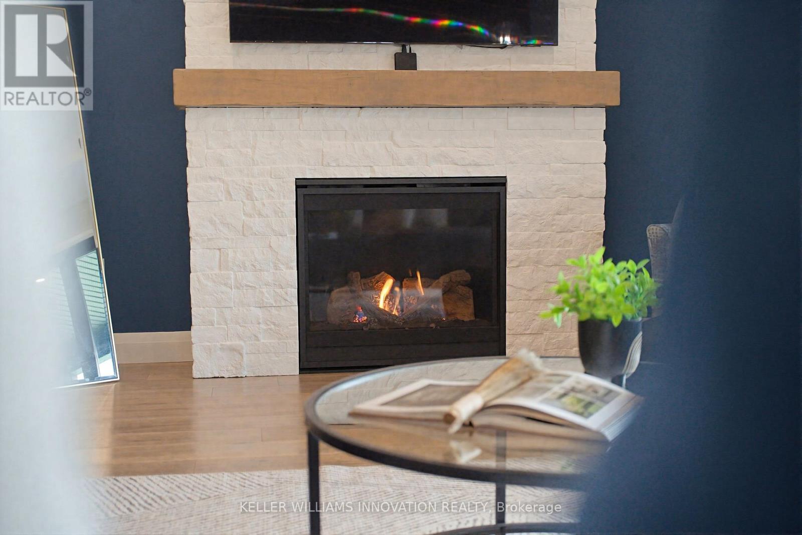 37 Gilmer Crescent, North Perth, ON - Indoor Photo Showing Living Room With Fireplace