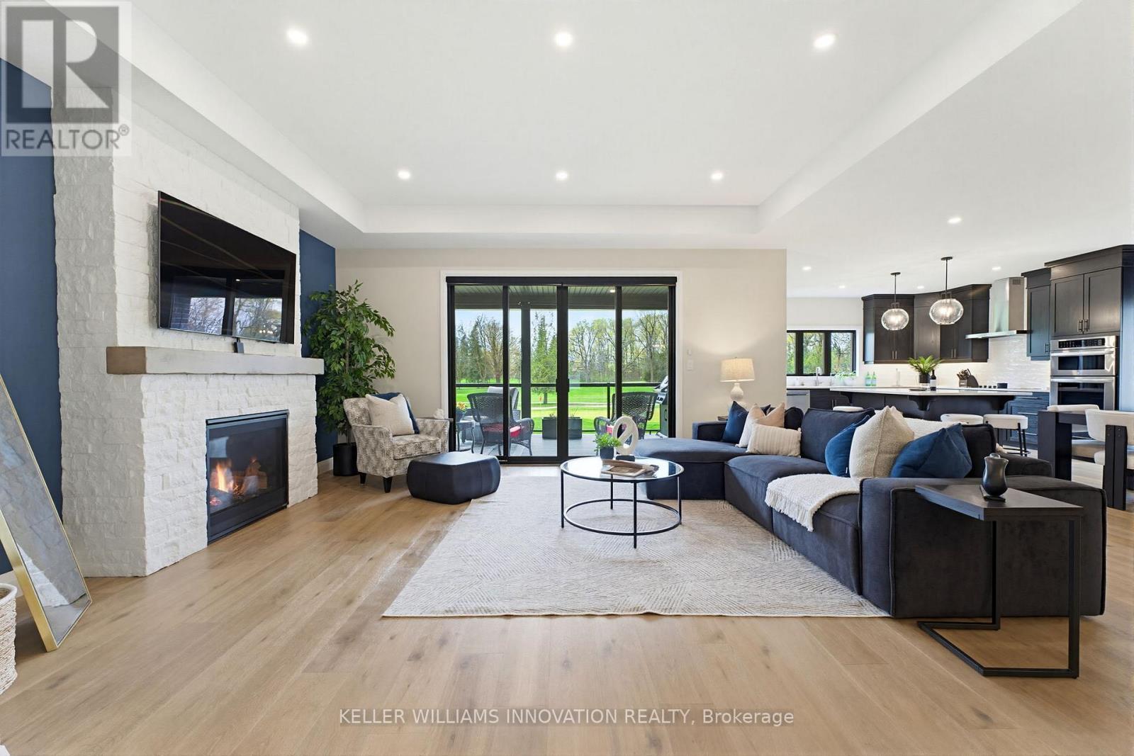 37 Gilmer Crescent, North Perth, ON - Indoor Photo Showing Living Room With Fireplace
