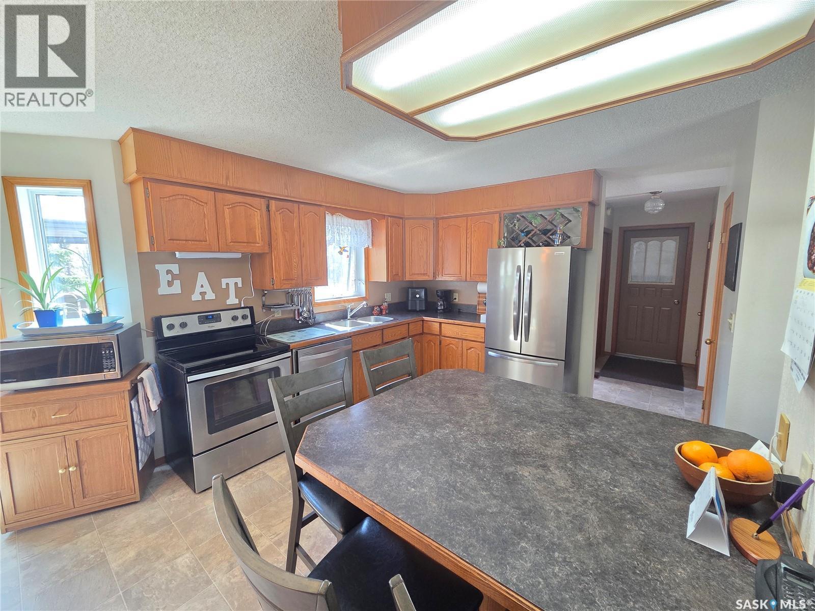 509 Carlyle Avenue, Carlyle, SK - Indoor Photo Showing Kitchen With Stainless Steel Kitchen With Double Sink