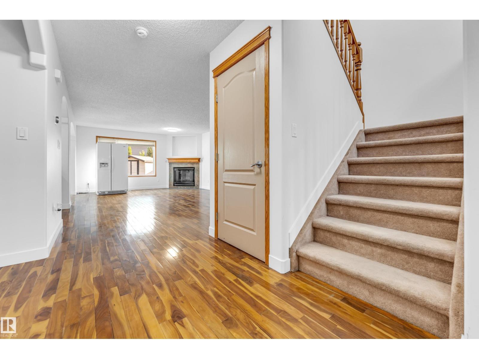 10621 175A Av Nw, Edmonton, AB - Indoor Photo Showing Other Room With Fireplace