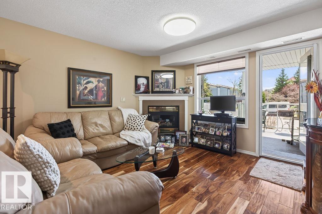 #112 6703 172 St Nw, Edmonton, AB - Indoor Photo Showing Living Room With Fireplace