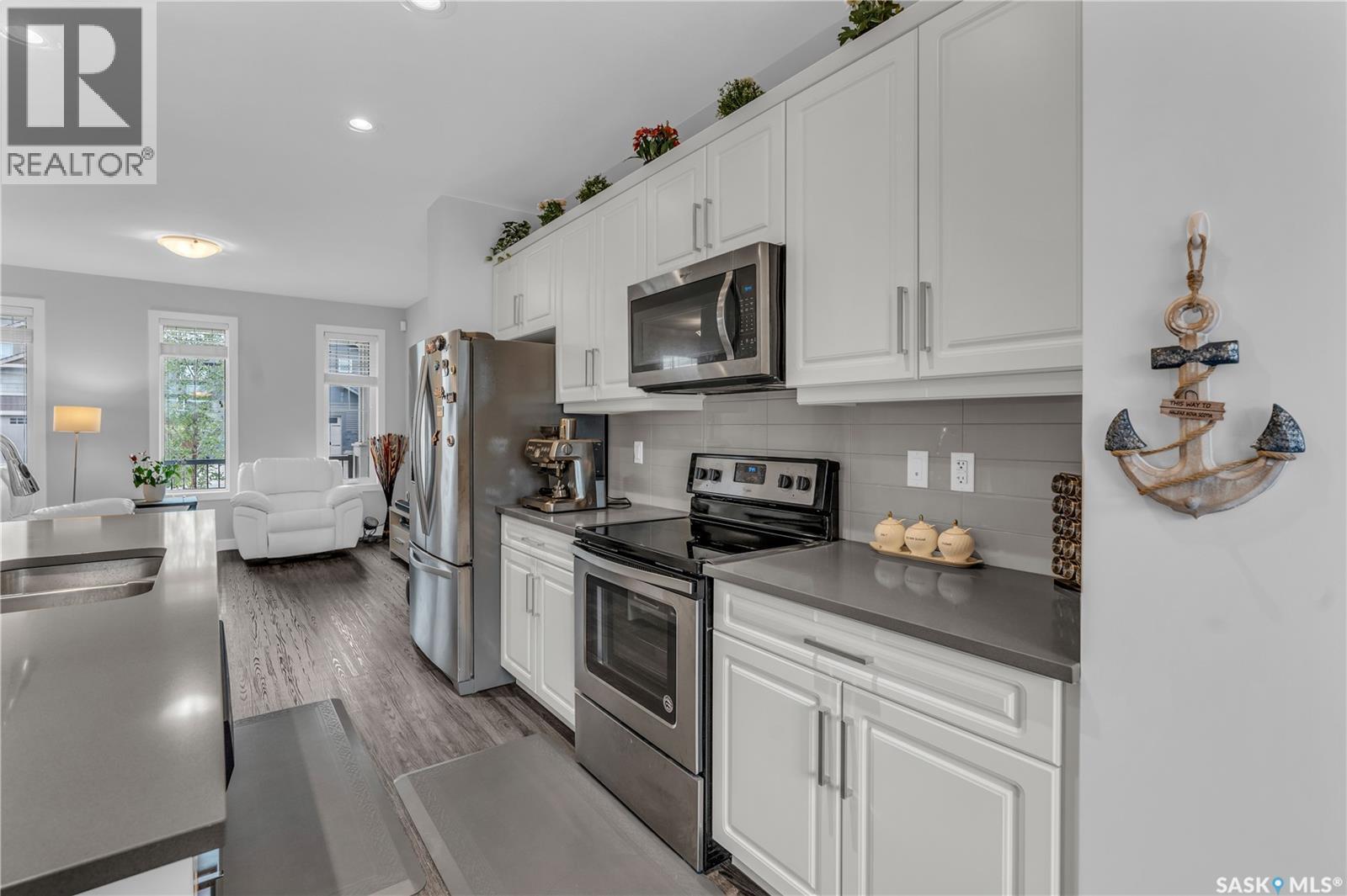 219 Newton Link, Saskatoon, SK - Indoor Photo Showing Kitchen With Stainless Steel Kitchen With Double Sink