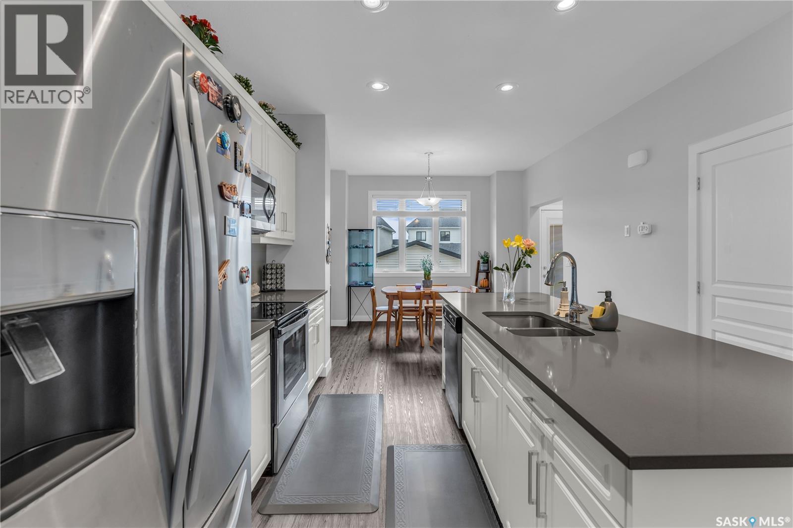 219 Newton Link, Saskatoon, SK - Indoor Photo Showing Kitchen With Stainless Steel Kitchen With Double Sink