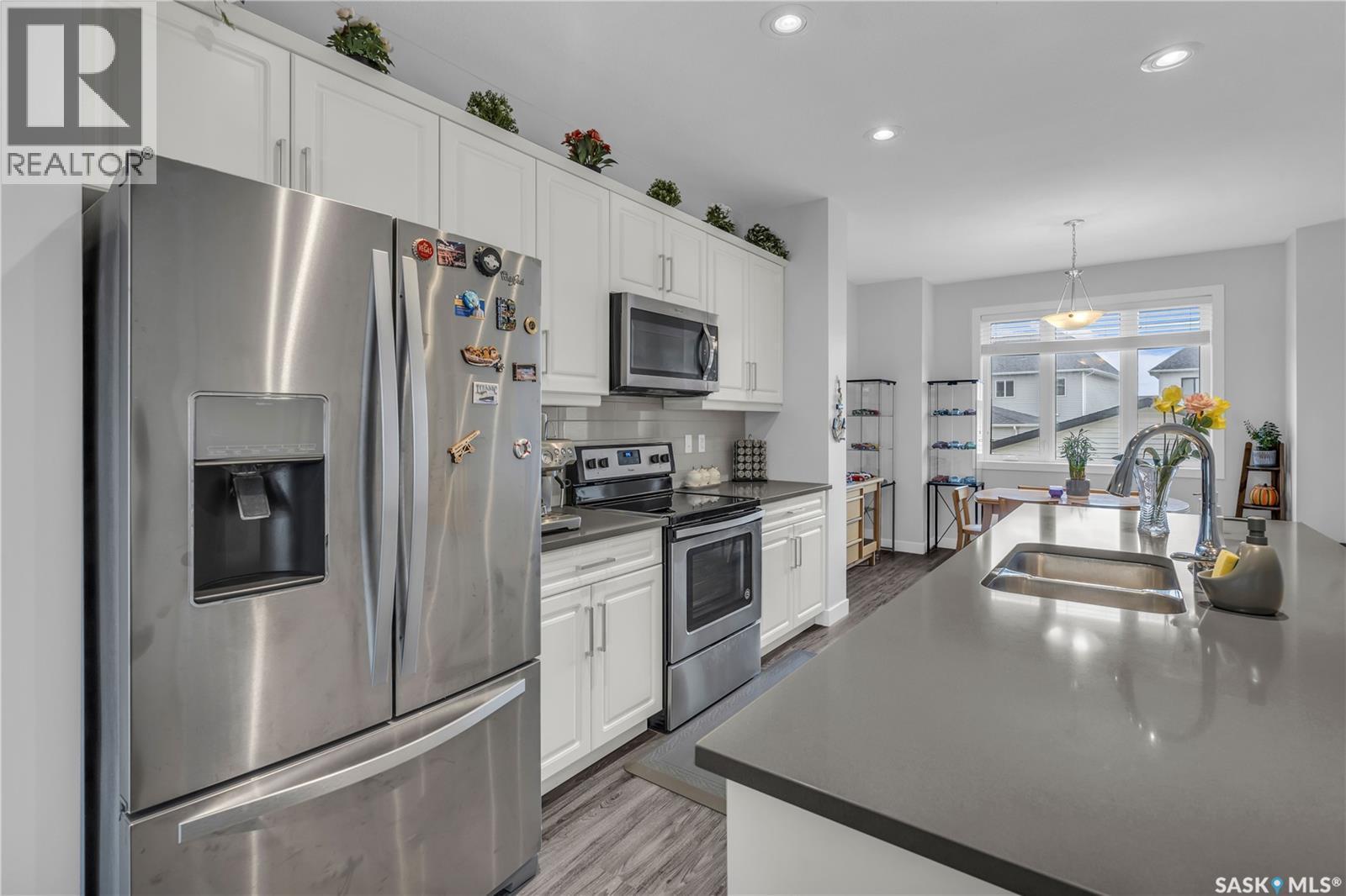 219 Newton Link, Saskatoon, SK - Indoor Photo Showing Kitchen With Stainless Steel Kitchen With Double Sink With Upgraded Kitchen