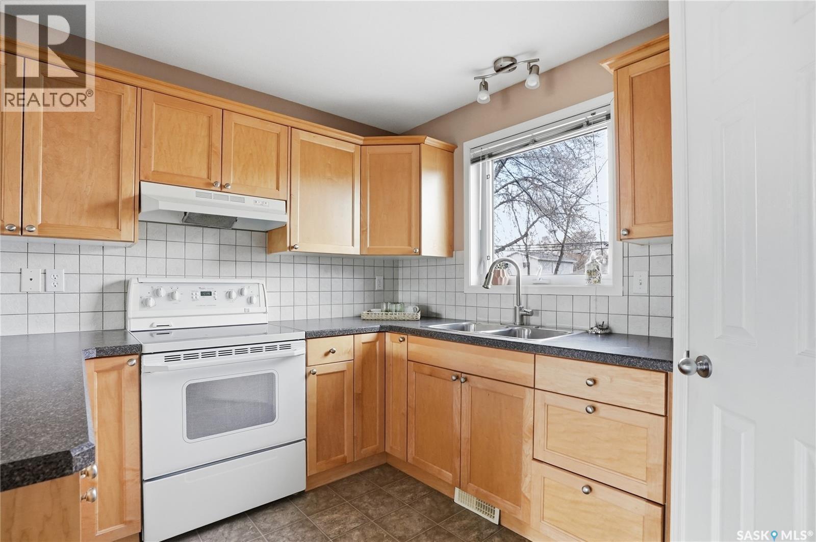 1426B C Avenue N, Saskatoon, SK - Indoor Photo Showing Kitchen With Double Sink