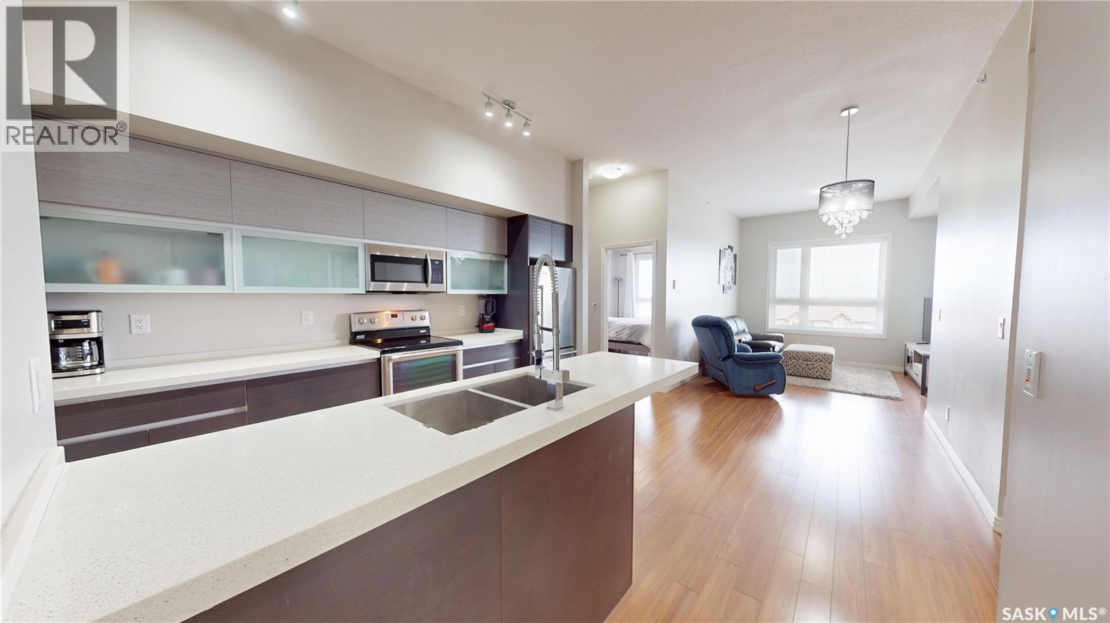 312 235 Evergreen Square, Saskatoon, SK - Indoor Photo Showing Kitchen With Double Sink With Upgraded Kitchen