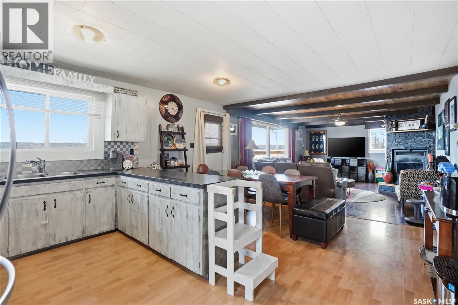608 Aurora Street, Saskatchewan Beach, SK - Indoor Photo Showing Kitchen With Fireplace