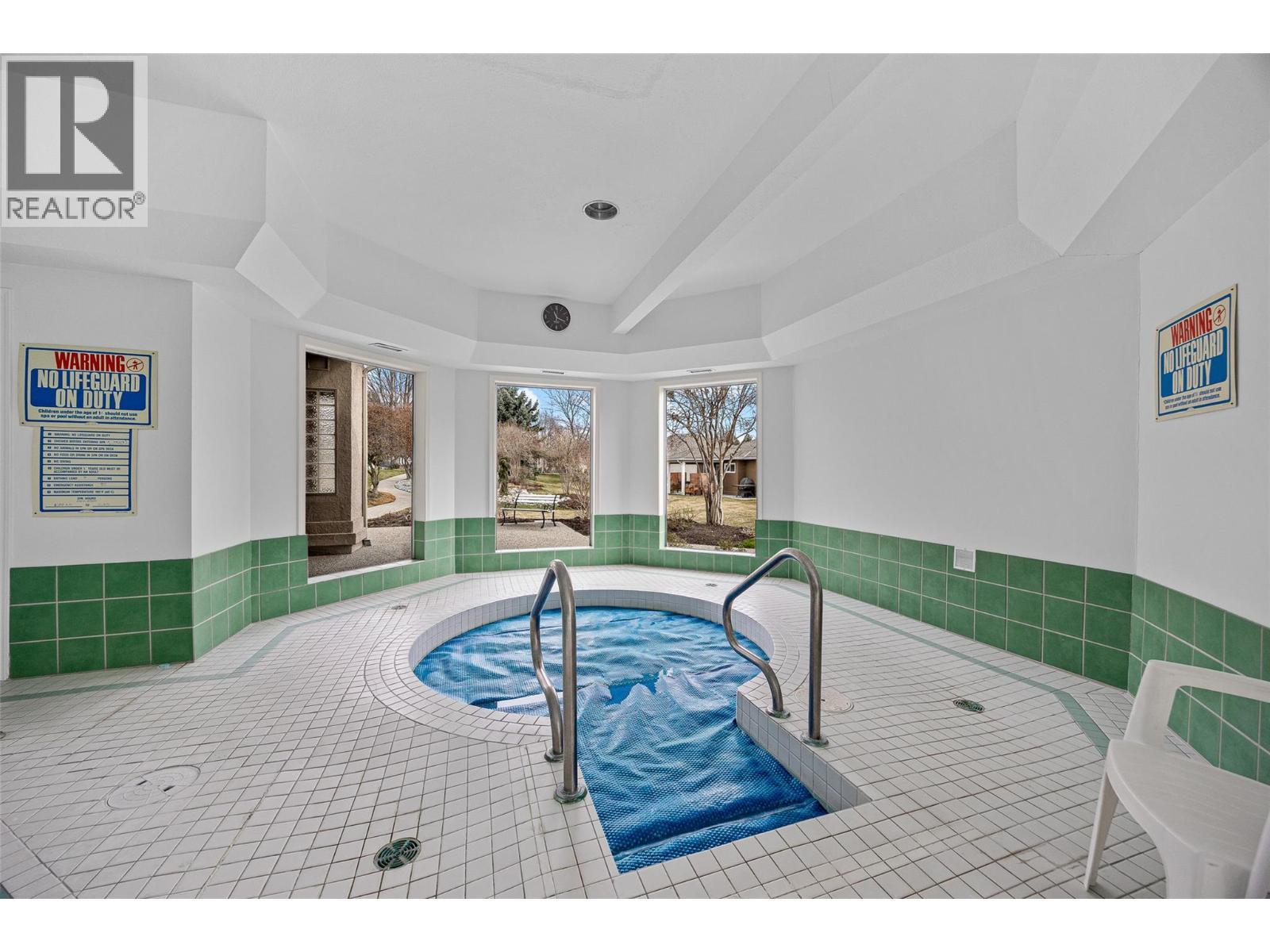 615 Glenmeadows Road Unit# 49, Kelowna, BC - Indoor Photo Showing Other Room With In Ground Pool